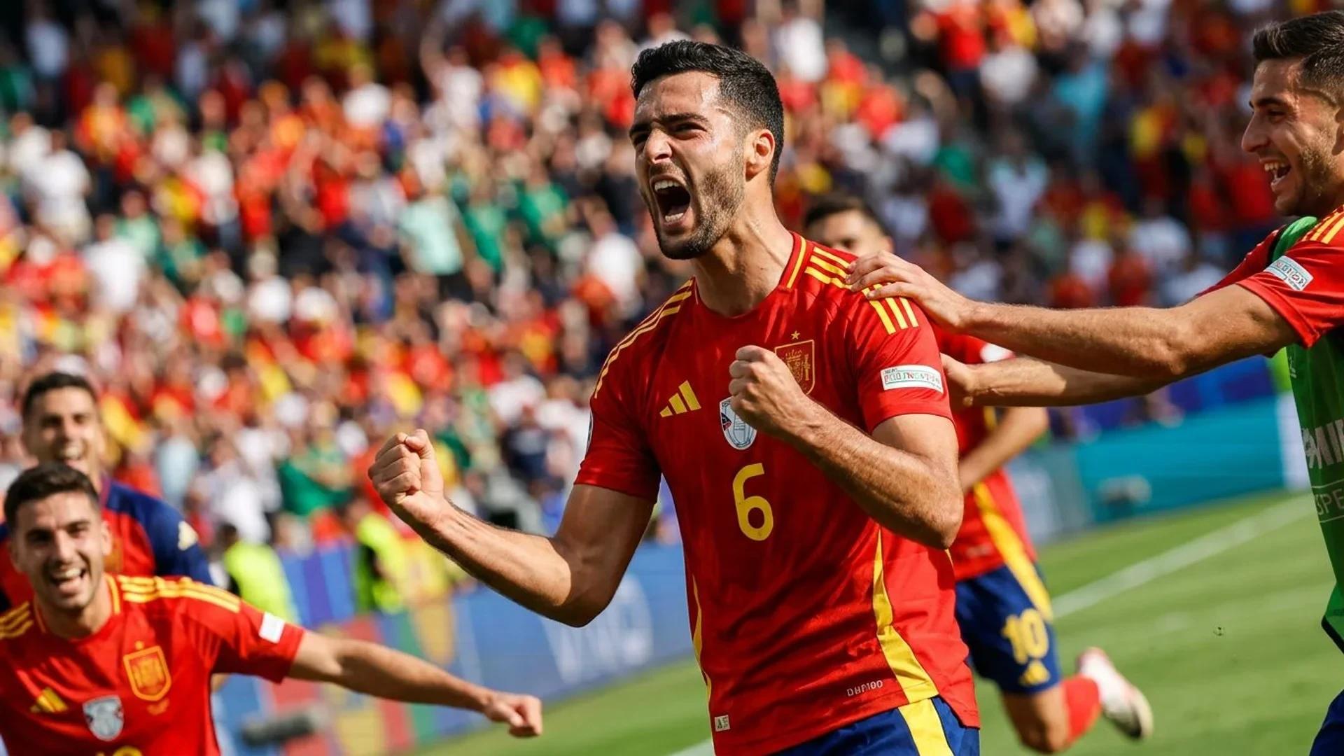 Mikel Merino celebrating on the football pitch after scoring a goal.