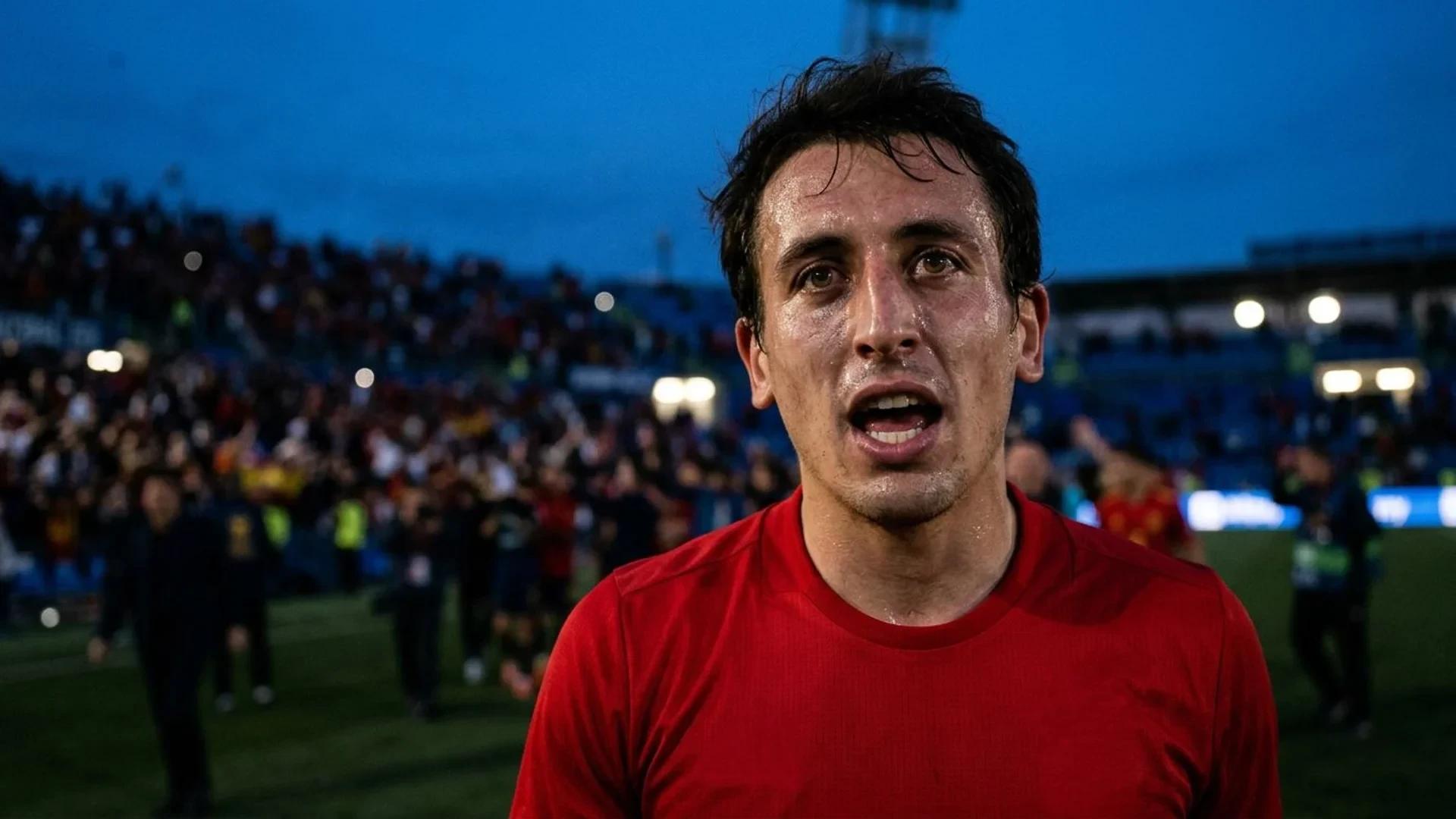 Close-up of a football player with intense expression surrounded by blurred stadium lights during dusk.