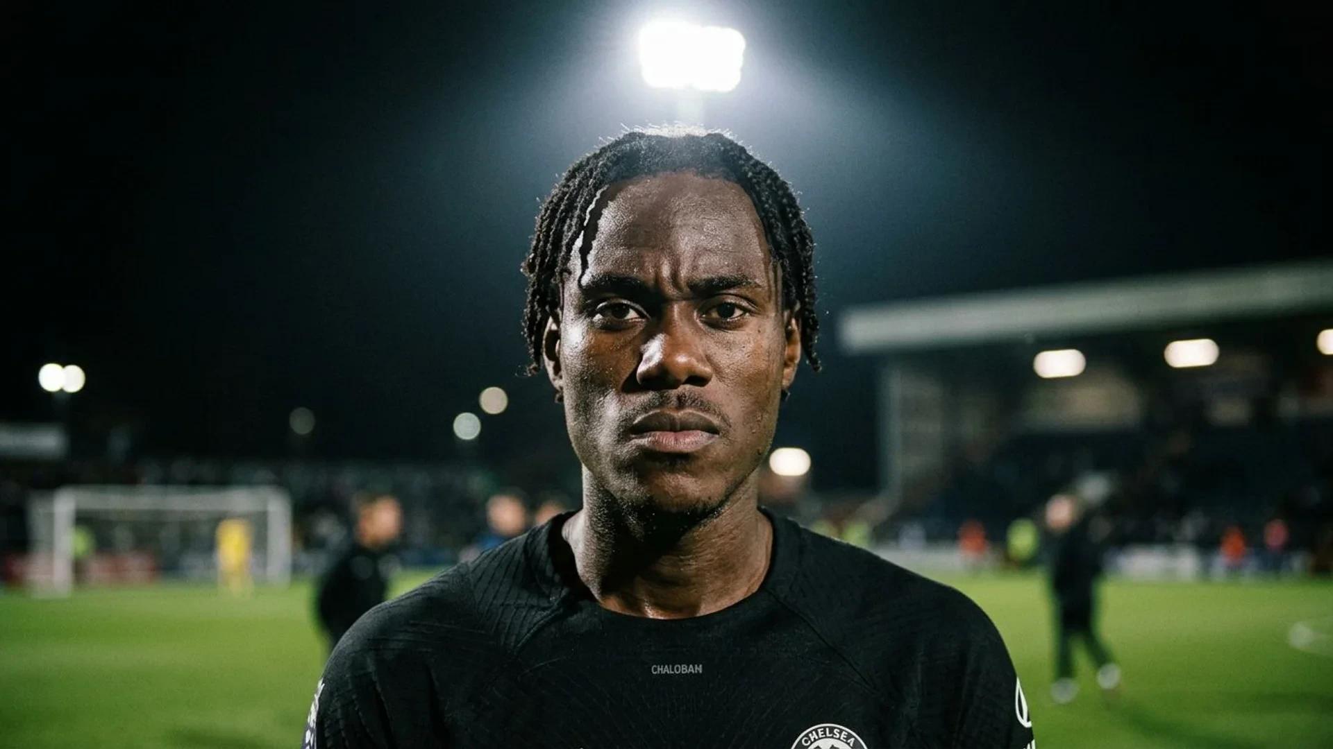 A close-up portrait of Trevoh Chalobah with a focused expression under dramatic lighting.
