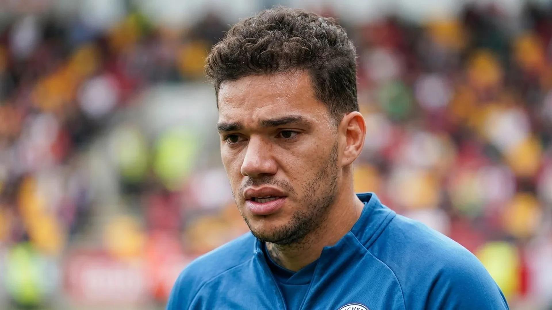 Close-up portrait of Brazilian footballer Ederson showing a pensive expression.