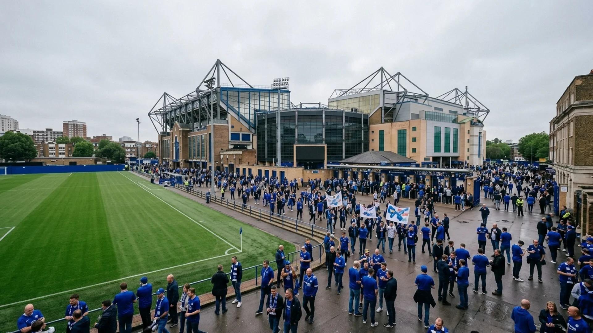 Stamford Bridge stadium filled with fans under an overcast sky.