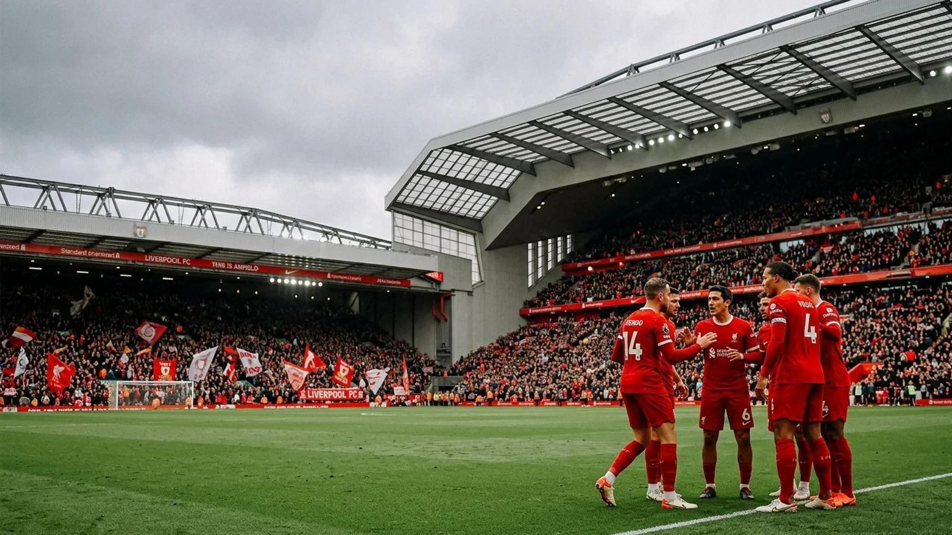 A wide shot of Liverpool players, including Andoni Iraola, engaged in a discussion at Anfield under overcast skies.