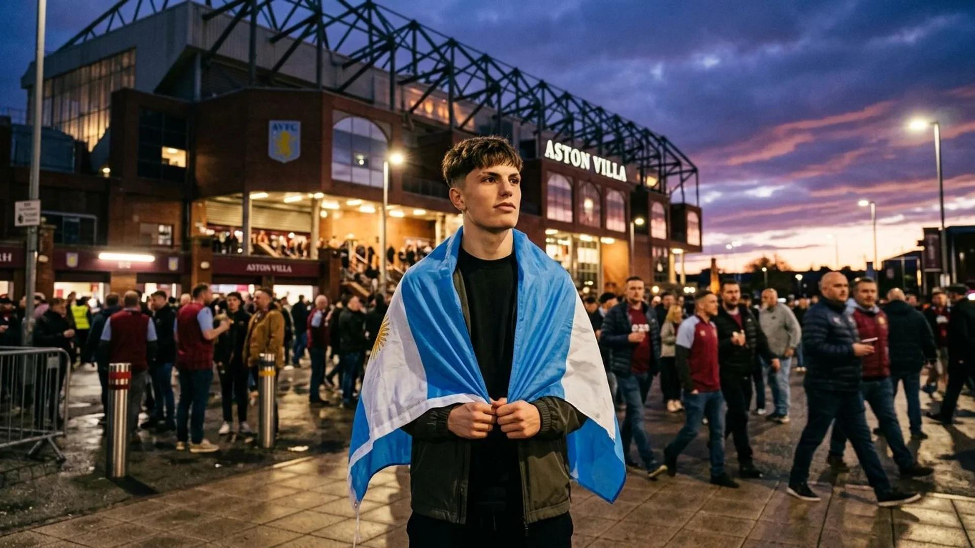 Alejandro Garnacho drapes an Argentine flag over his shoulders outside Aston Villa's stadium at dusk.