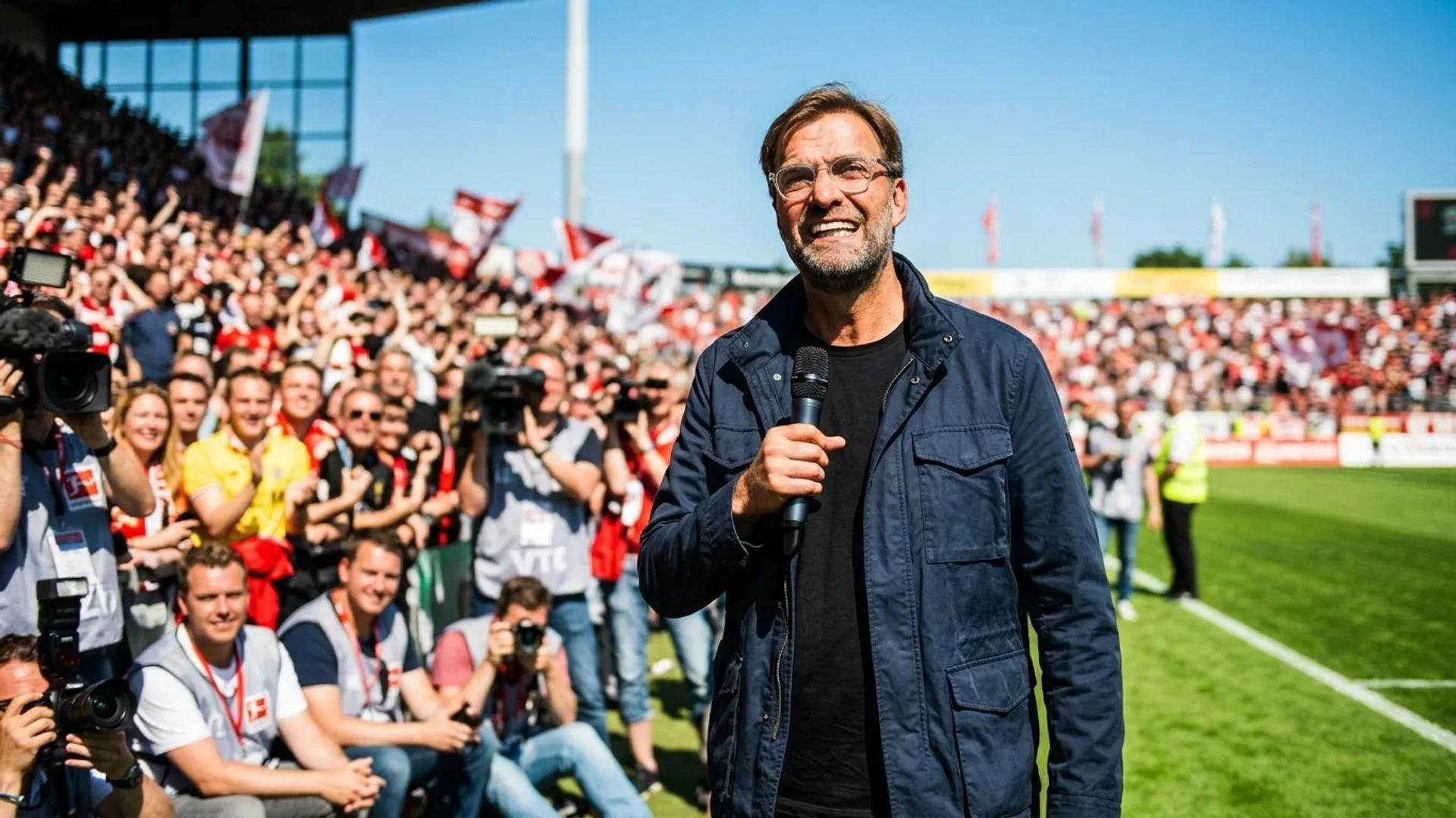 Jürgen Klopp standing confidently in front of an excited crowd during a press conference.