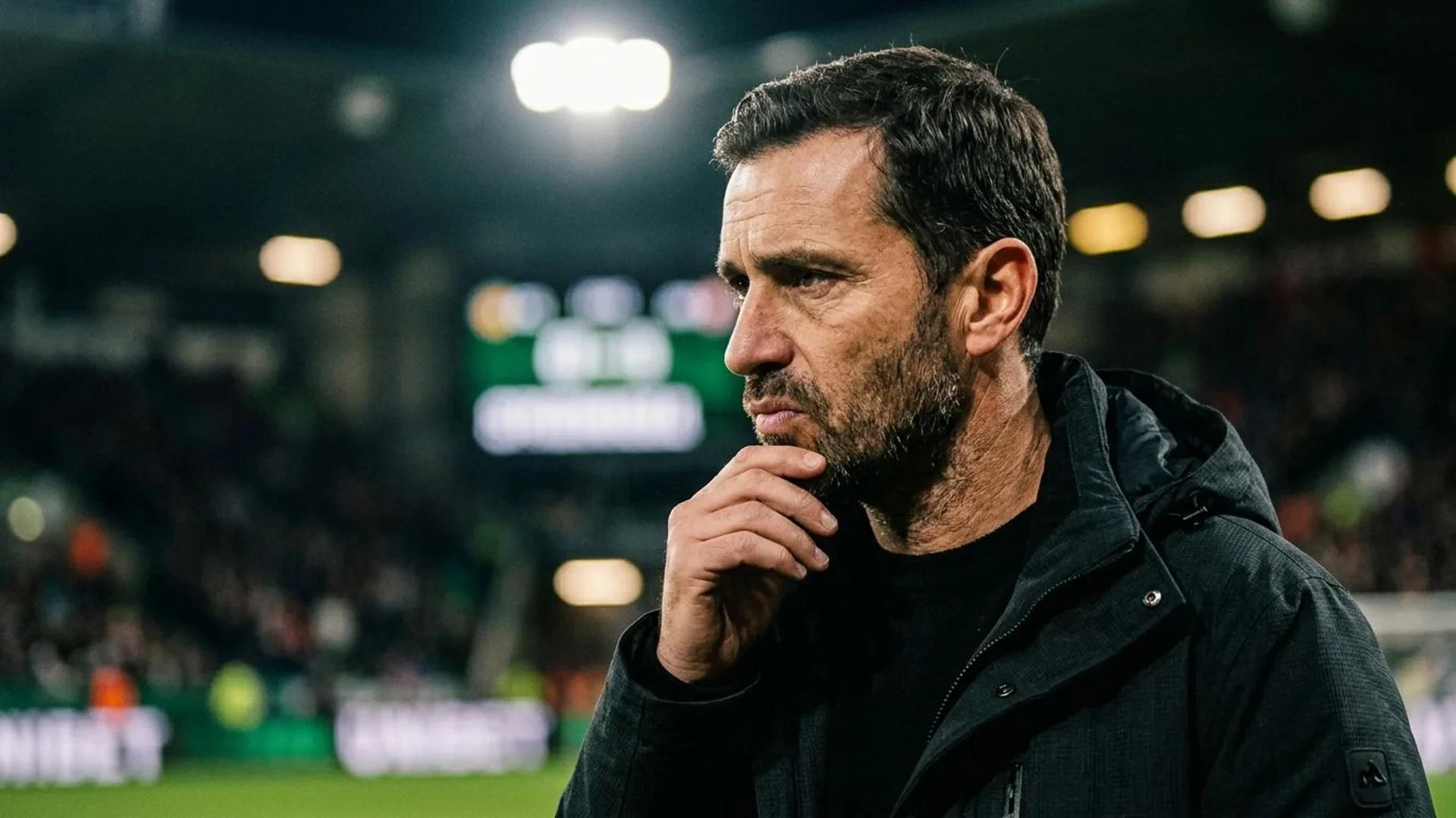 Close-up of Enzo Maresca deep in thought under strong lighting.