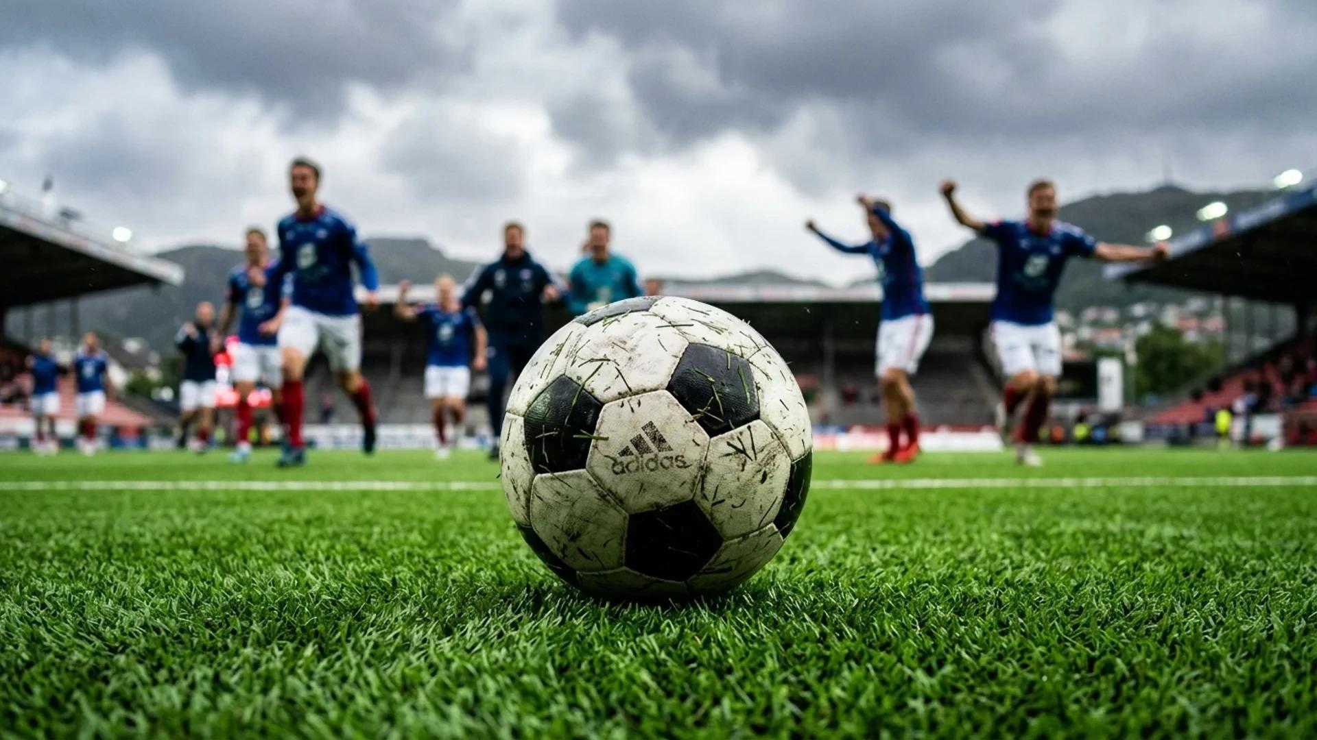 A close-up of a soccer ball on the green turf of Brann Stadion.