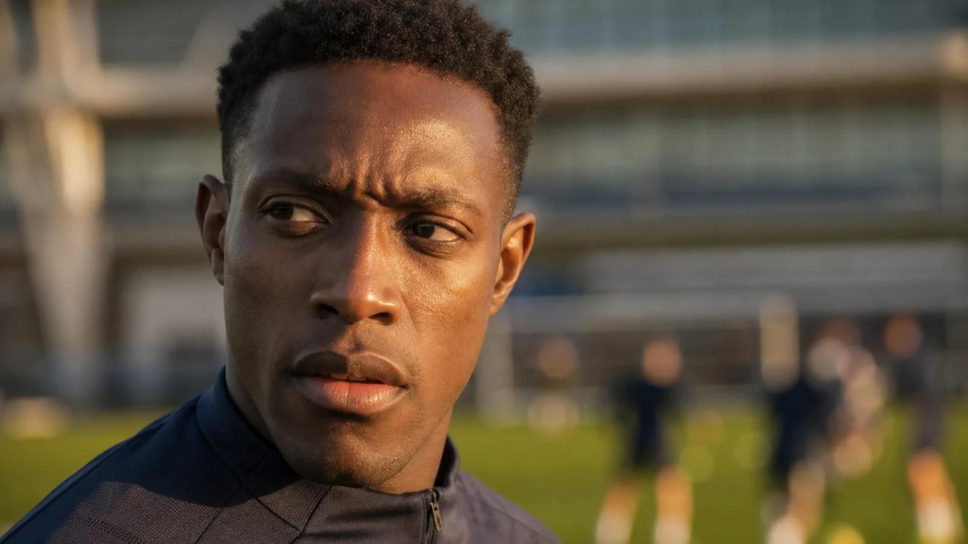 Danny Welbeck in a training session, expressing determination.