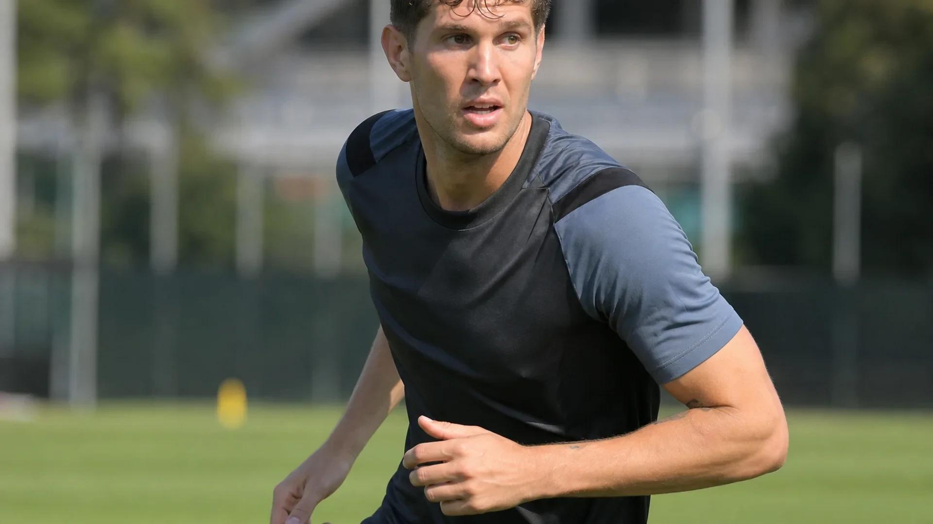 John Stones training with Inter Milan, showing determination.