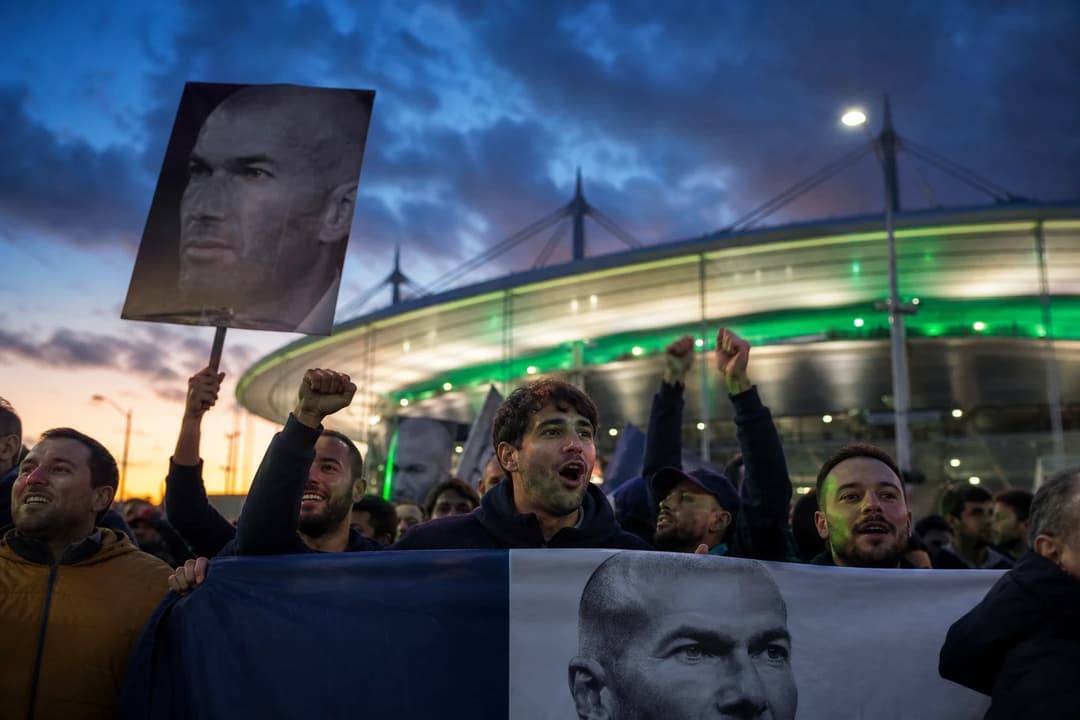 A group of football fans gathered outside the Stade de France in Paris, waiting for a press conference about Zinédine Zidane's appointment.