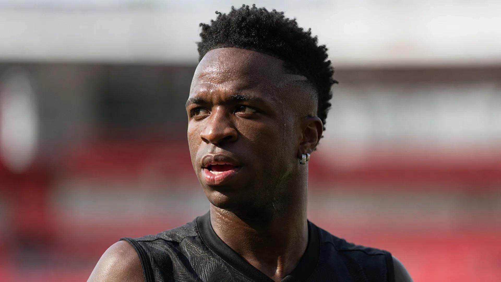Vinicius Junior training on the pitch at the Emirates Stadium, showcasing determination and focus.