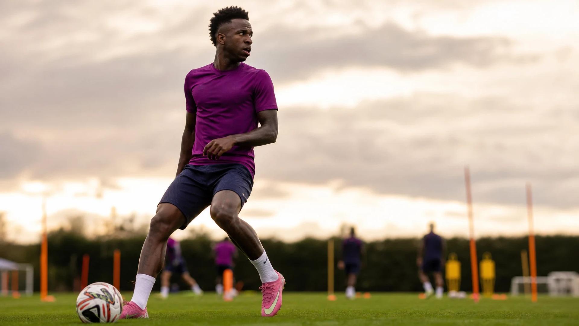 Vinicius Junior practicing on a training pitch with focus and intensity.