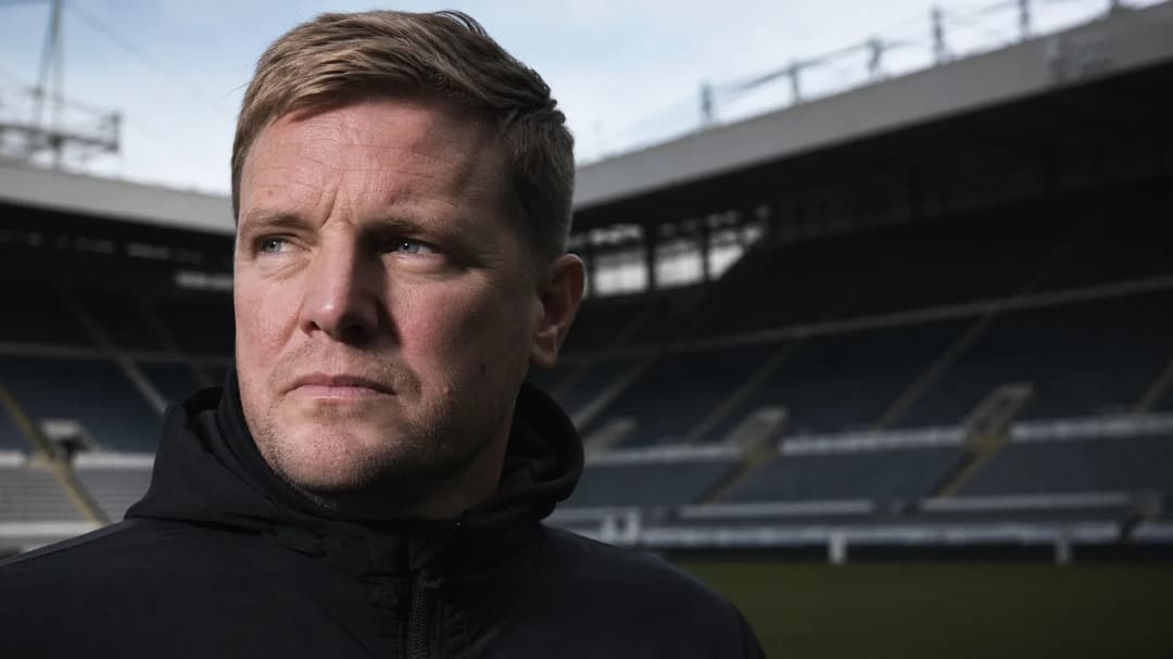 Eddie Howe standing in front of St. James' Park, reflecting on his departure as head coach.