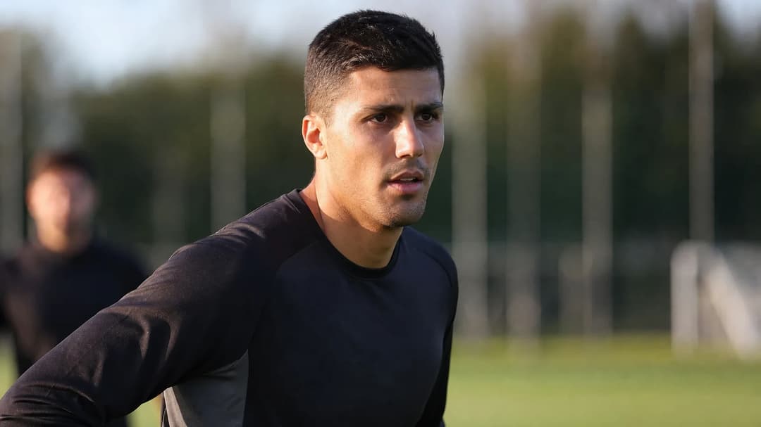 Close-up of Rodri during a training session, focused and determined.