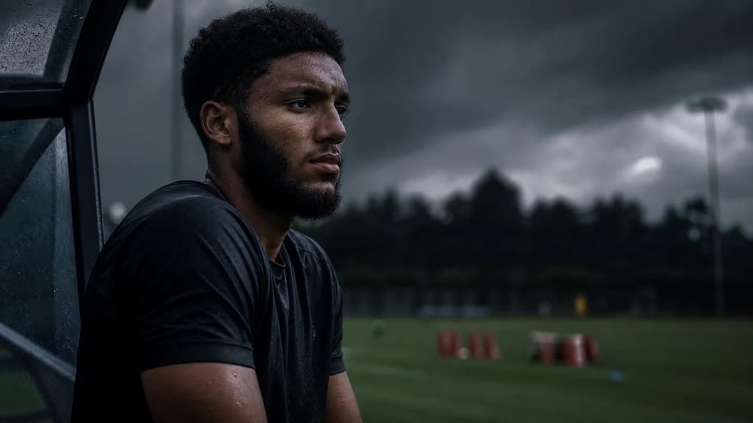 Joe Gomez reflecting on the sidelines after an injury during a preseason match.