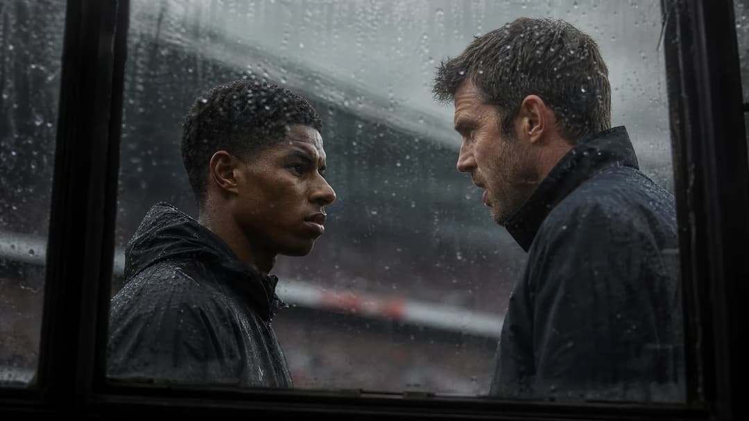 Marcus Rashford and Michael Carrick interact through a rain-soaked window at Old Trafford.