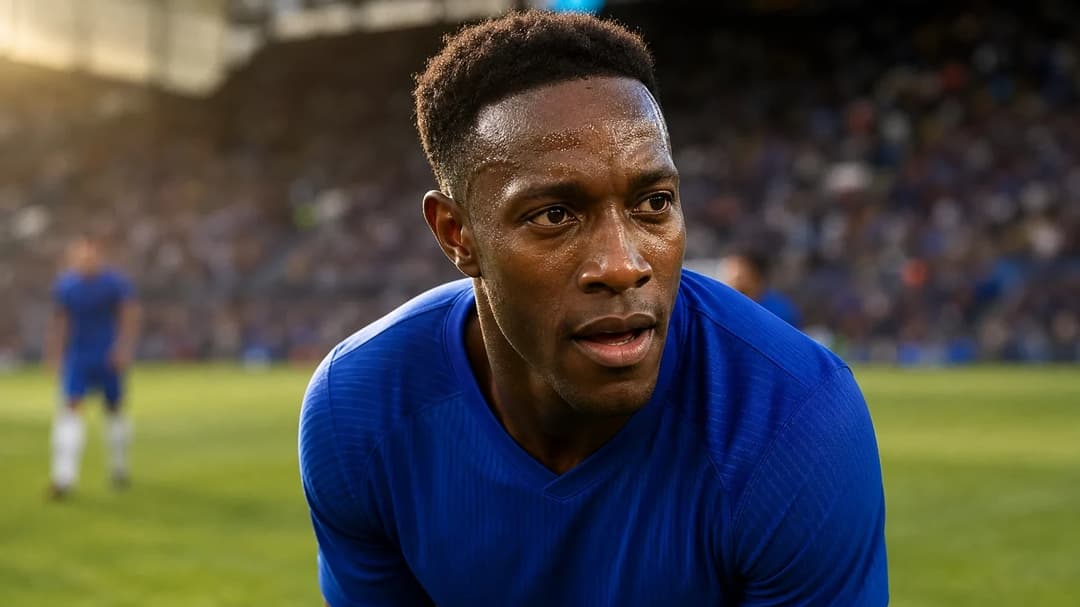 Danny Welbeck focused on the pitch during a match.
