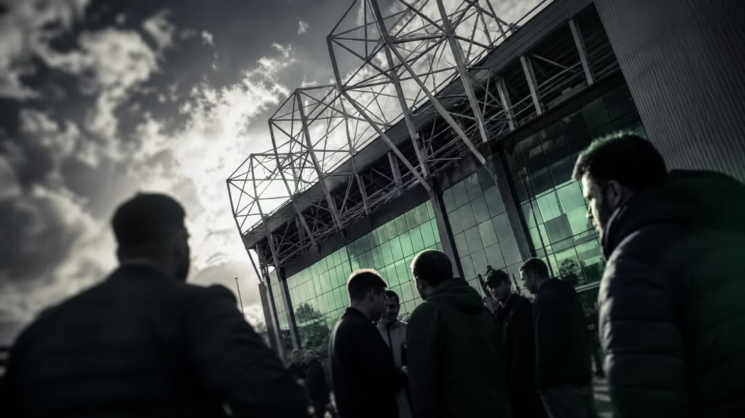 Dramatic shot of Old Trafford with fans discussing the upcoming season.