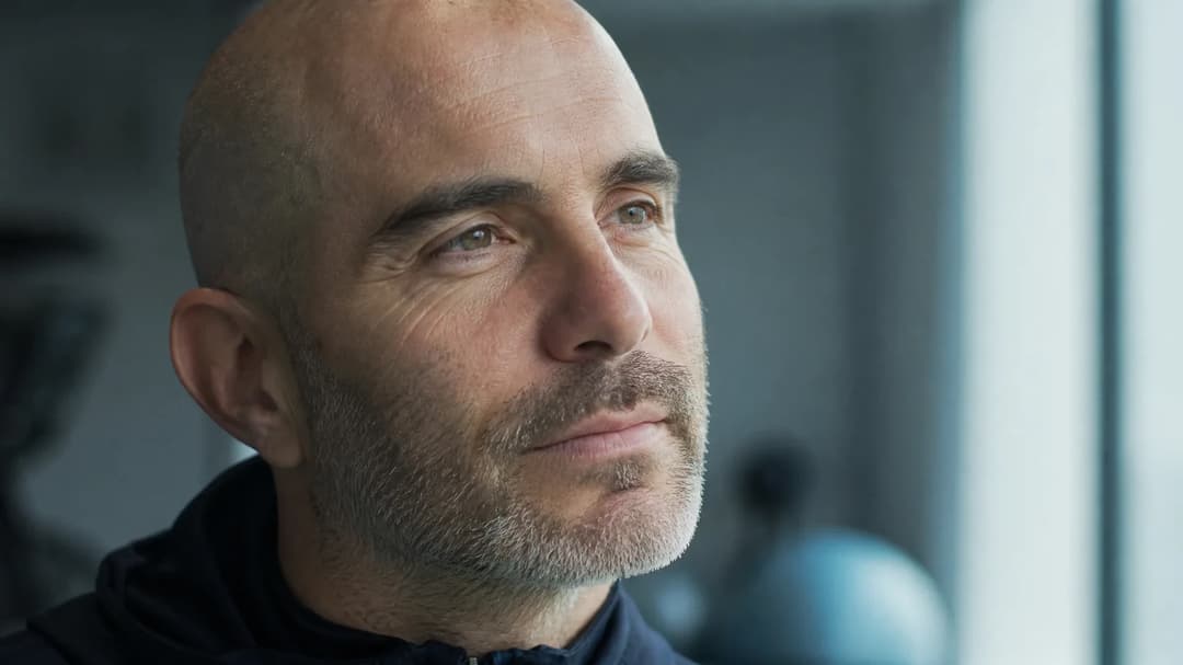 Enzo Maresca in a candid moment, showcasing his calm demeanor before the Manchester derby.