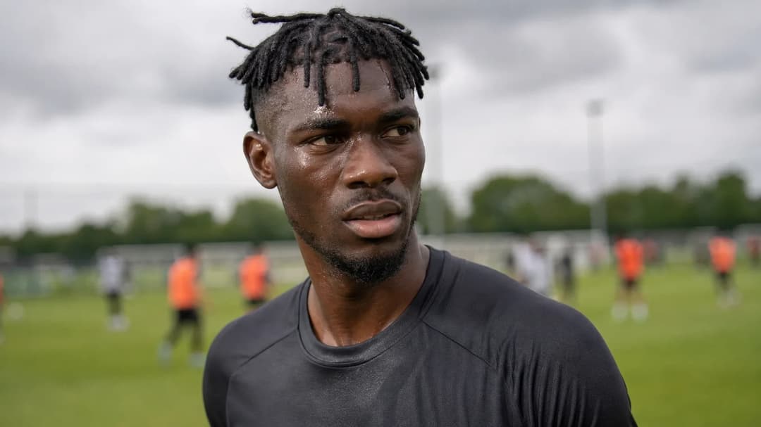 Yves Bissouma in a football setting, displaying determination and focus.
