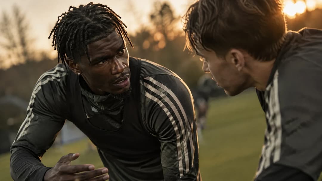 Yves Bissouma and a teammate engaged in a tense discussion during training in Amsterdam.