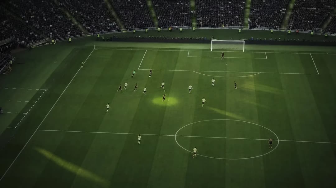 A bird's-eye view of the Camp Nou pitch with a silhouetted football player positioned as a centre-forward.