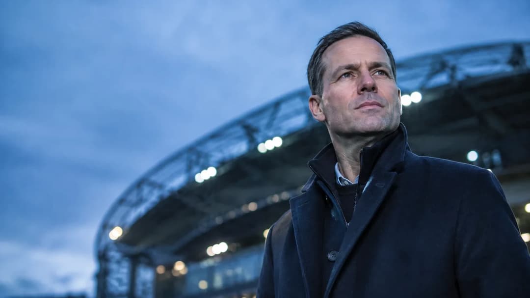Julian Ward standing at Anfield during blue-hour, looking determined.
