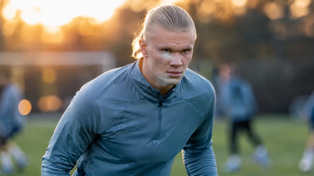 Erling Haaland intensely focused during a training session, captured in a close-up shot.