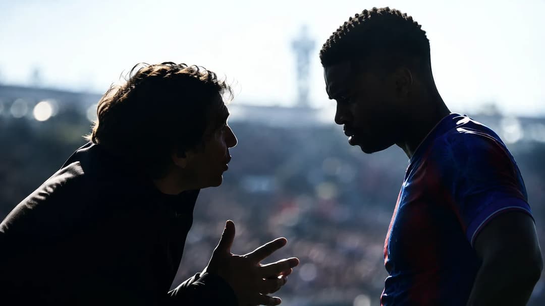 Rui Pinto and Marc Guéhi silhouetted against a bright football pitch.