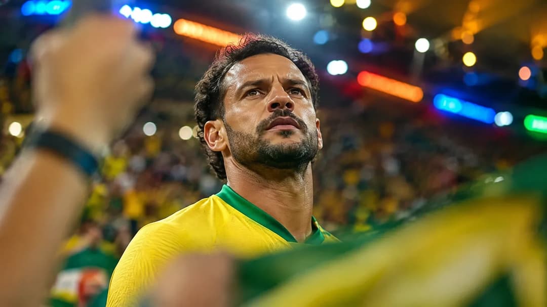 Fred in a crowded football stadium, displaying determination and excitement.