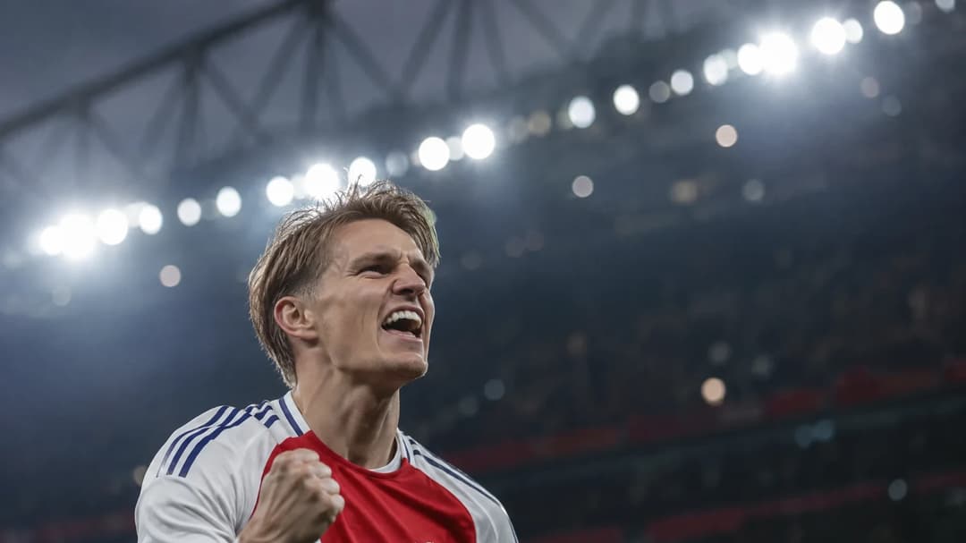 Martin Odegaard celebrating after scoring a goal.