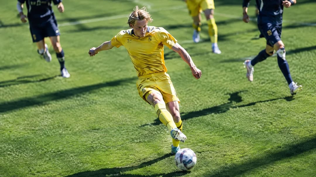 Ola Brynhildsen preparing to kick the ball during a football match.