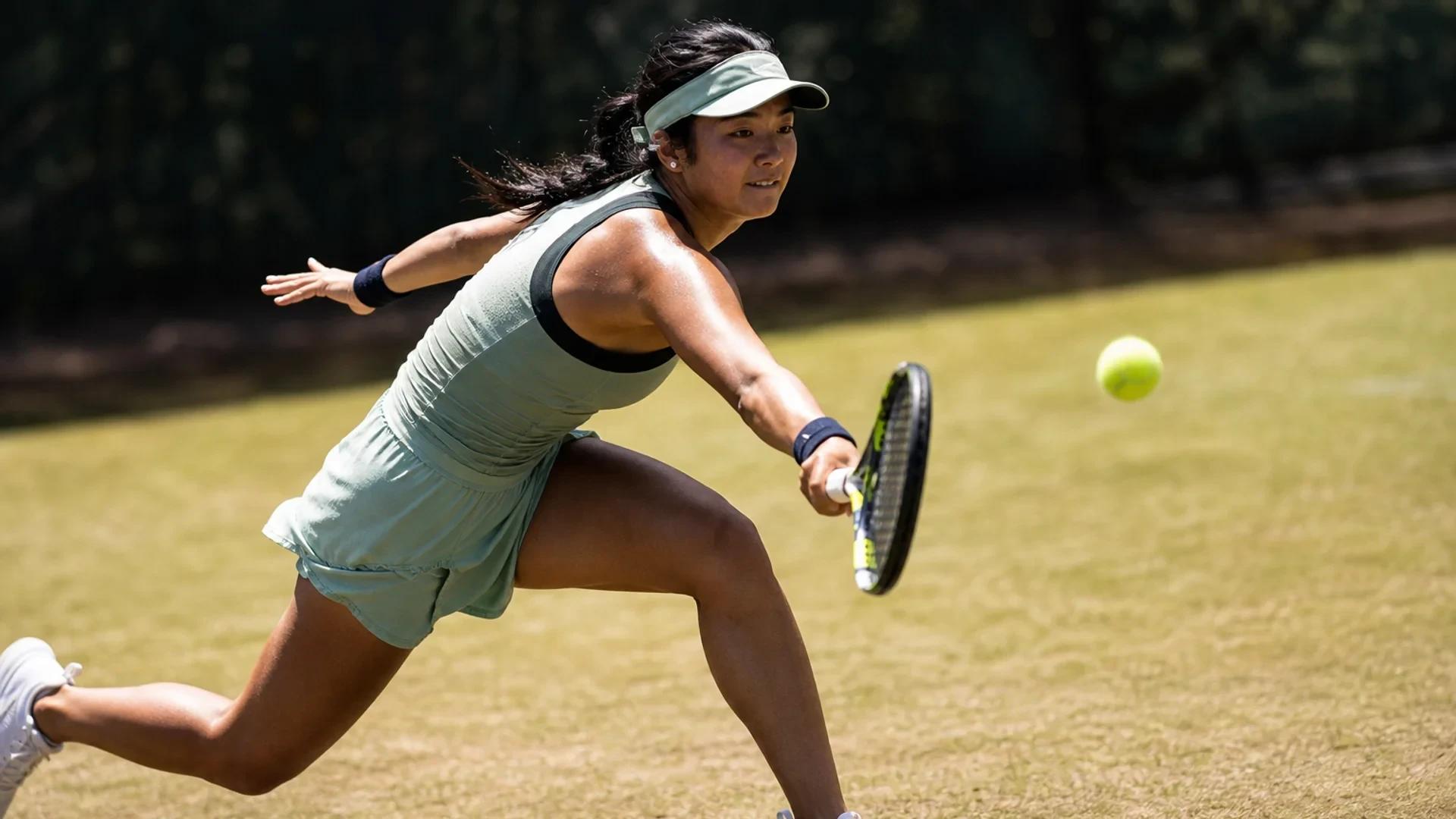 Alexandra Eala in action on the tennis court, captured from a low angle.