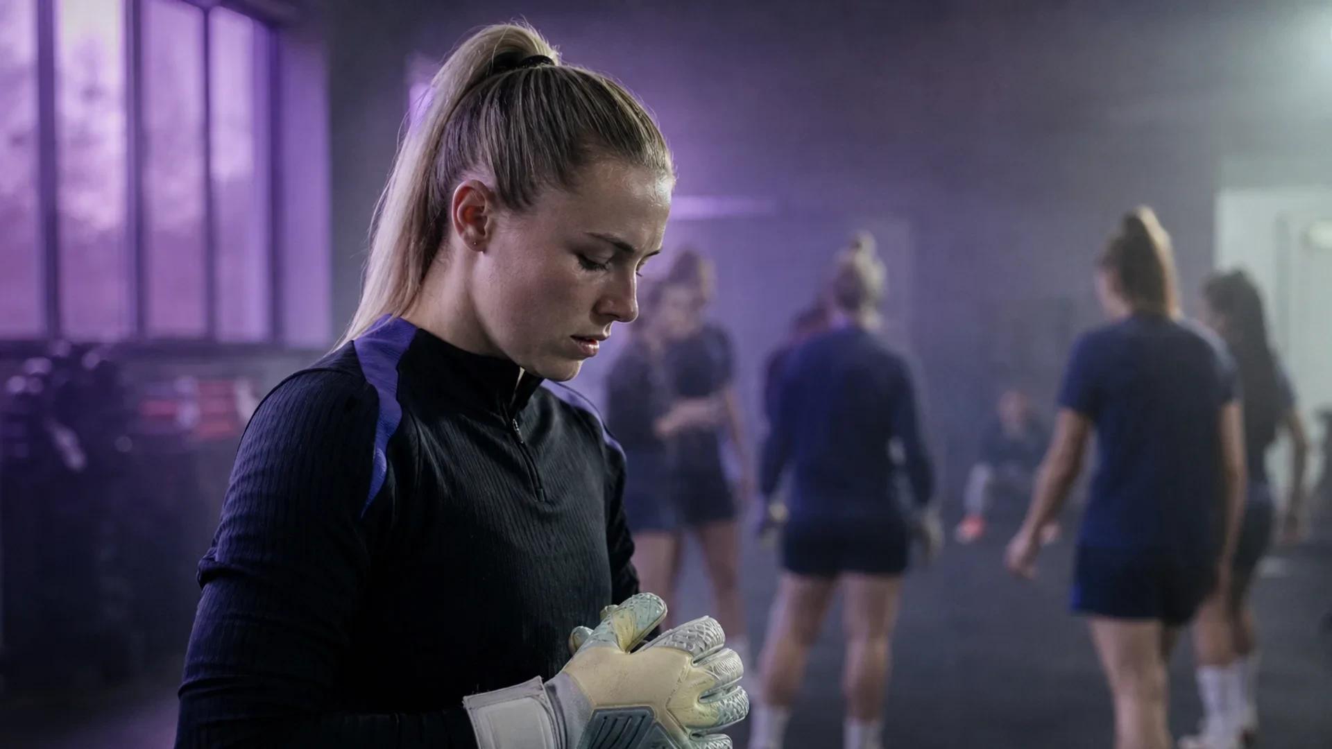 Goalkeeper Hannah Hampton preparing for training in the Chelsea locker room.