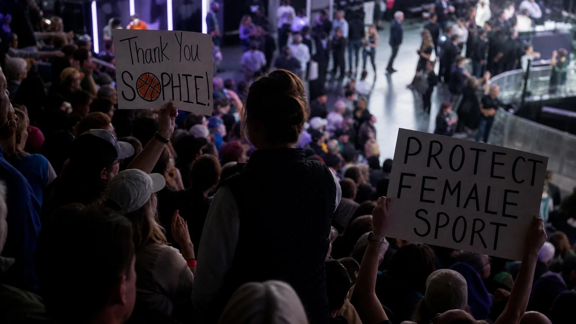 A tense moment inside Climate Pledge Arena with a silhouetted figure amid a supportive crowd.