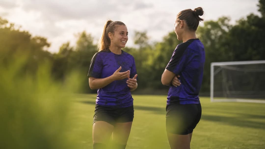 Beatrice Merlo and a teammate engaged in conversation during training.