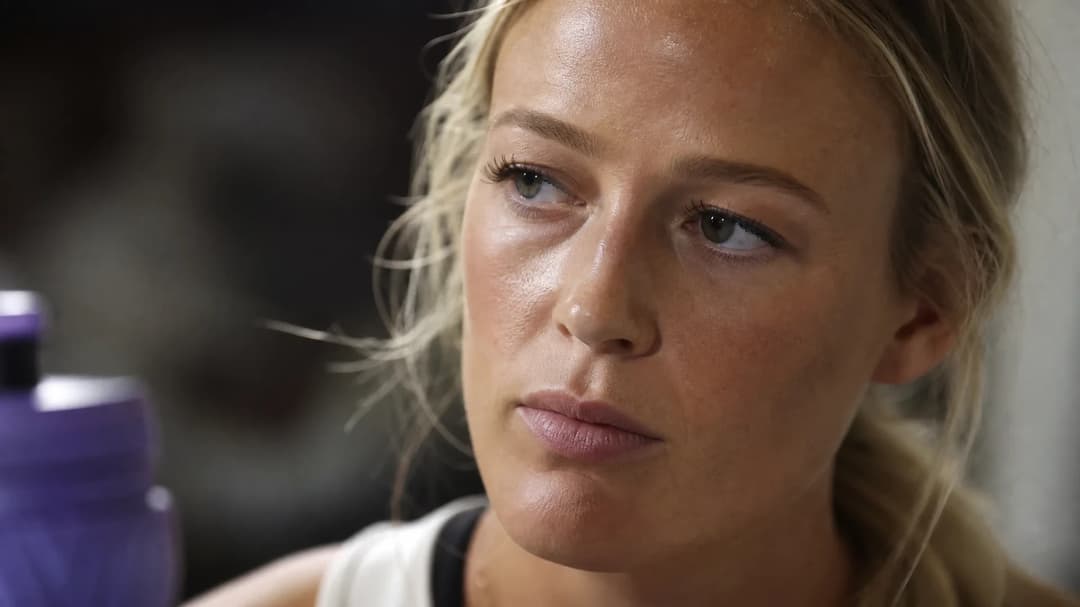 A close-up of Sophie Cunningham's face showing emotion after a controversial event.