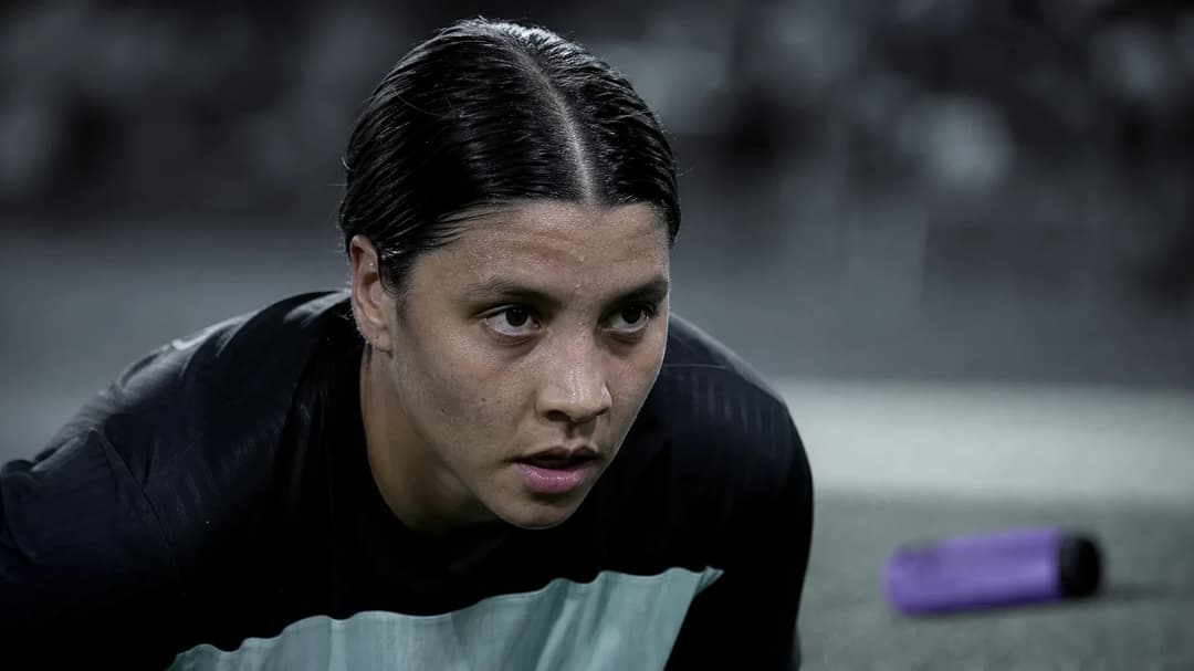 Close-up of footballer Sam Kerr preparing for a free kick.