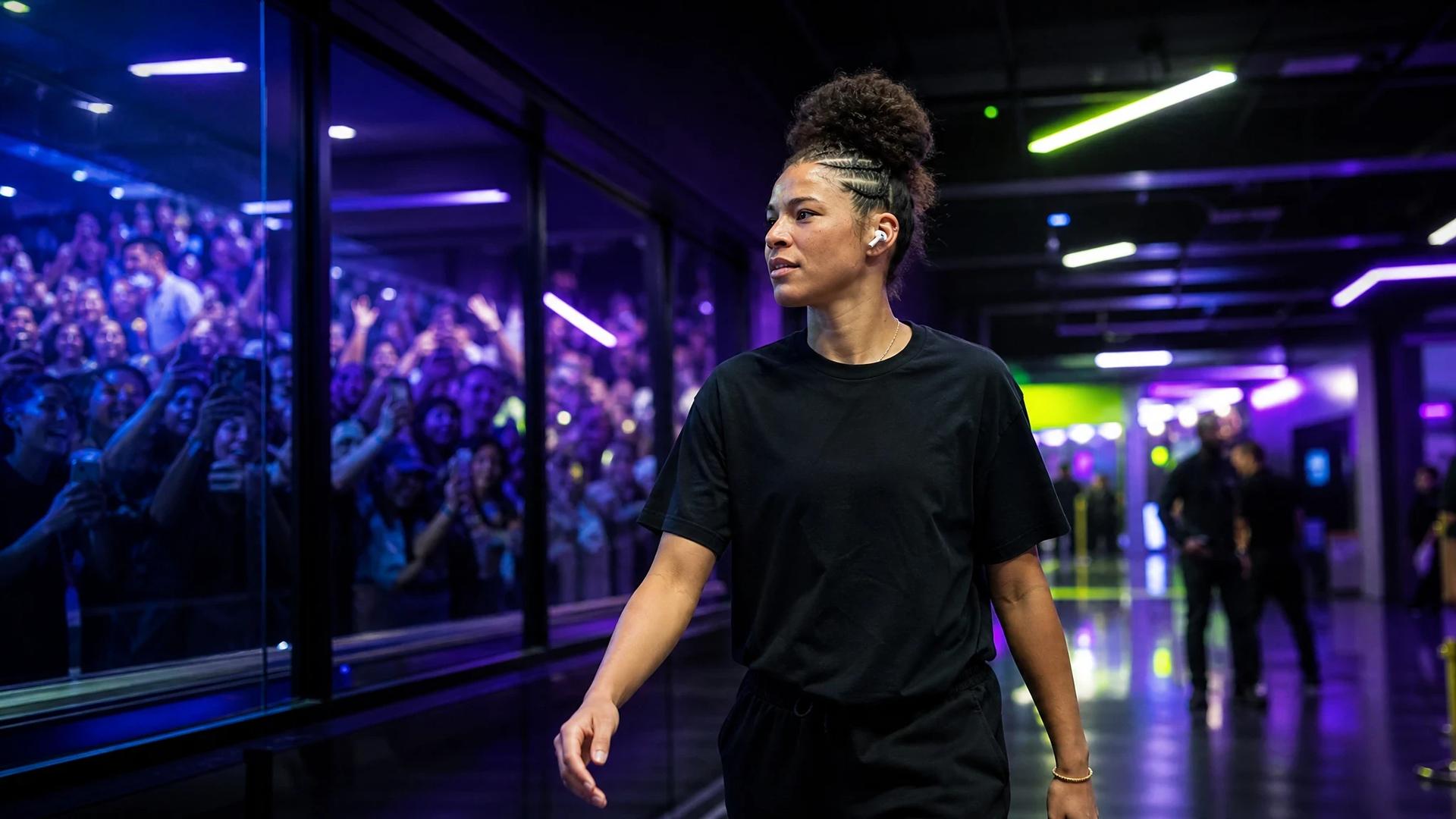 Veronica Burton walking through the vibrant hallways of a sports arena.
