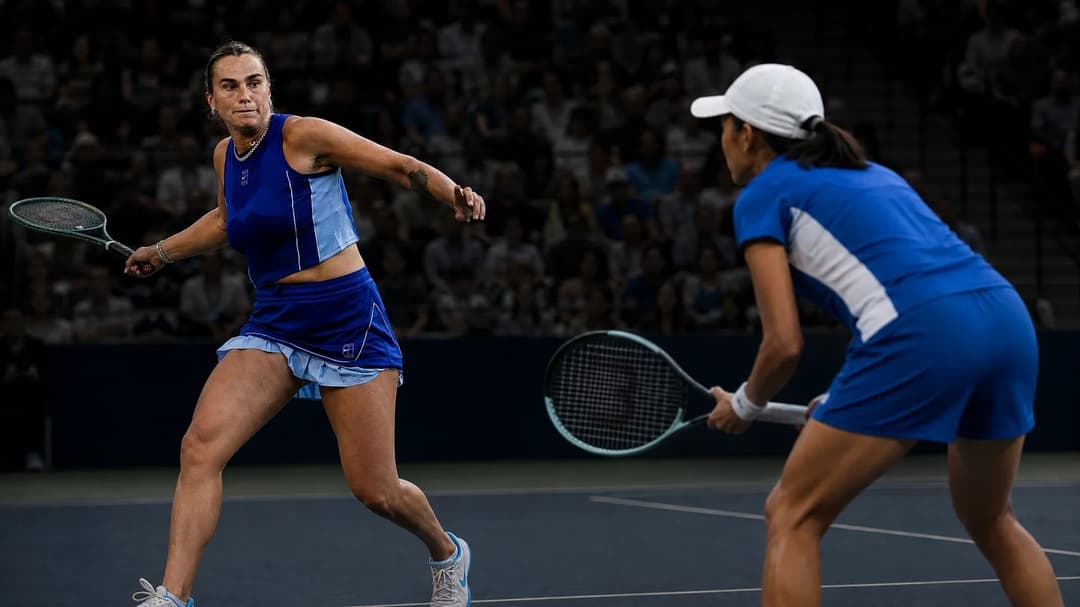 Aryna Sabalenka and Zhang Shuai in a tense moment before serving during a match.