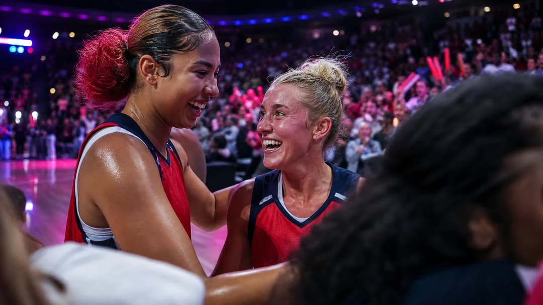 Shakira Austin and Sonia Citron celebrating a victory amidst a cheering crowd.