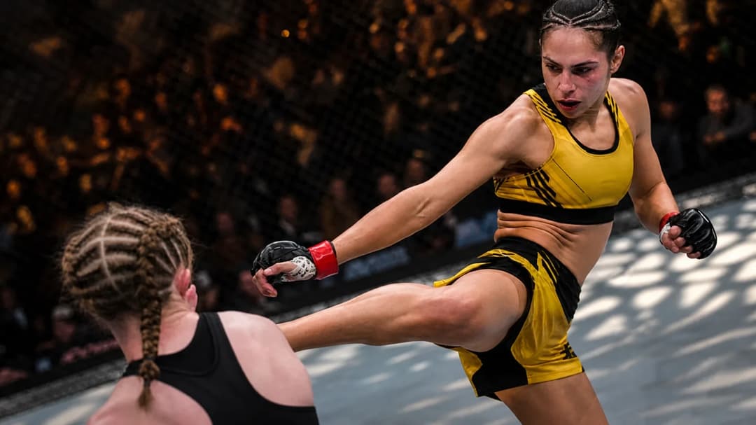Ariane Lipski in a tense moment before her fight at UFC 296, captured in a dynamic octagonal arena.