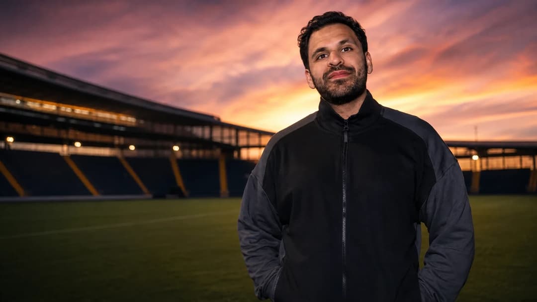 Zinar Spindari standing in front of AIK's stadium during sunset.