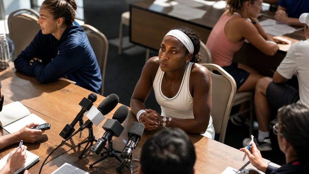 Coco Gauff during the Cincinnati Open Media Day, sitting at a press table with microphones.