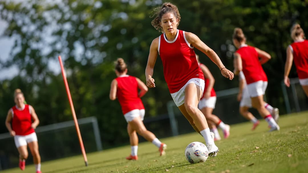 Midfielder Dafina Redzepi making an agile move with the football during training.