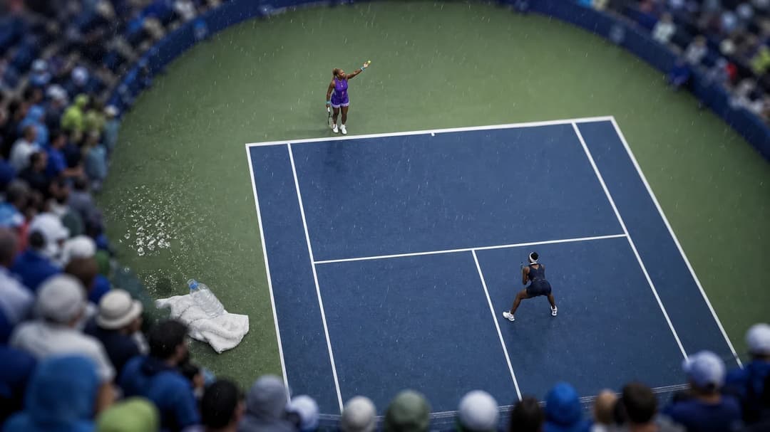 An overhead shot of a tense moment during a doubles tennis match at the Cincinnati Open featuring Serena and Venus Williams.