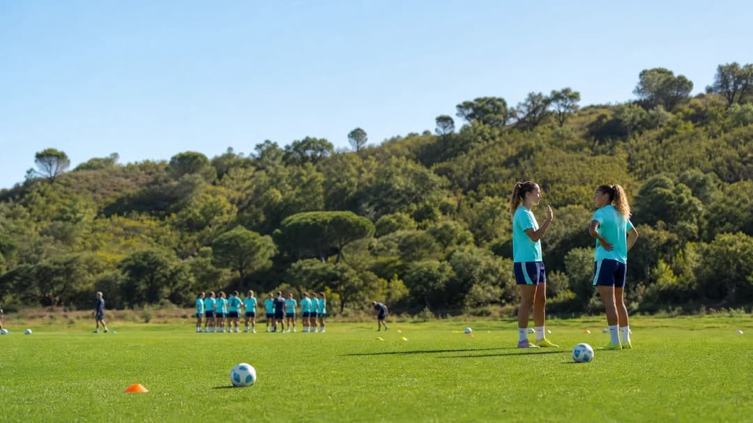 A candid moment of London City Lionesses in a huddle during a training camp in Portugal.