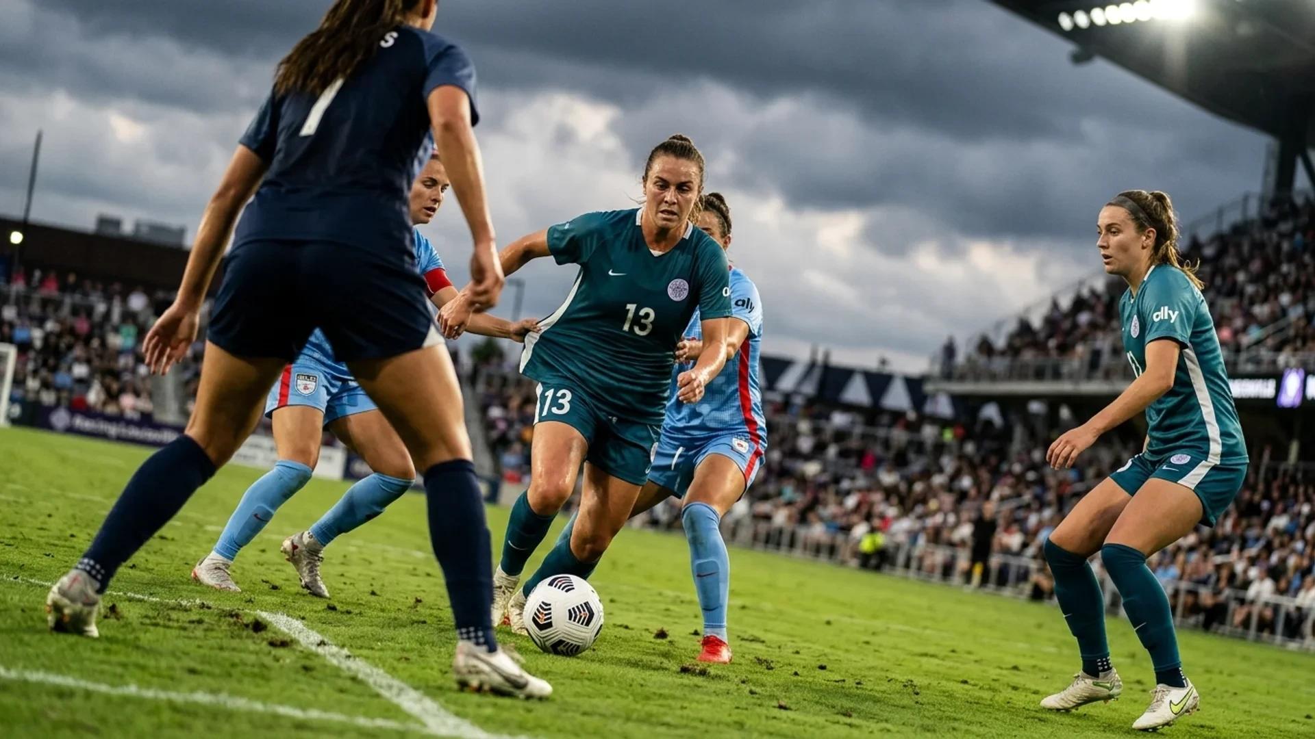 A women’s soccer match with Emma Sears dribbling the ball and Kayla Fischer positioned for a pass.
