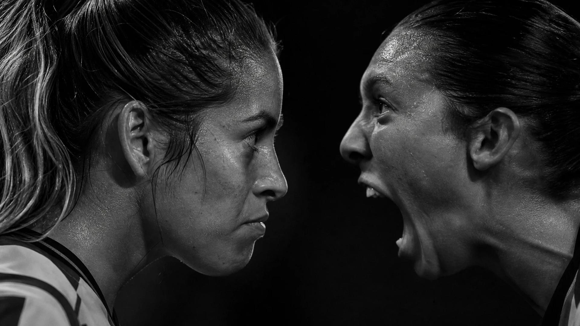 Extreme close-up of two football players from Chivas Femenil and Pachuca, showcasing their intense expressions.