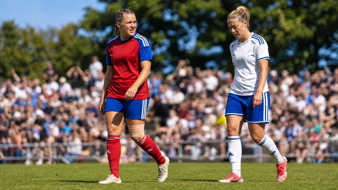 A low-angle shot of two football players on a sunlit pitch, displaying contrasting emotions after a match.