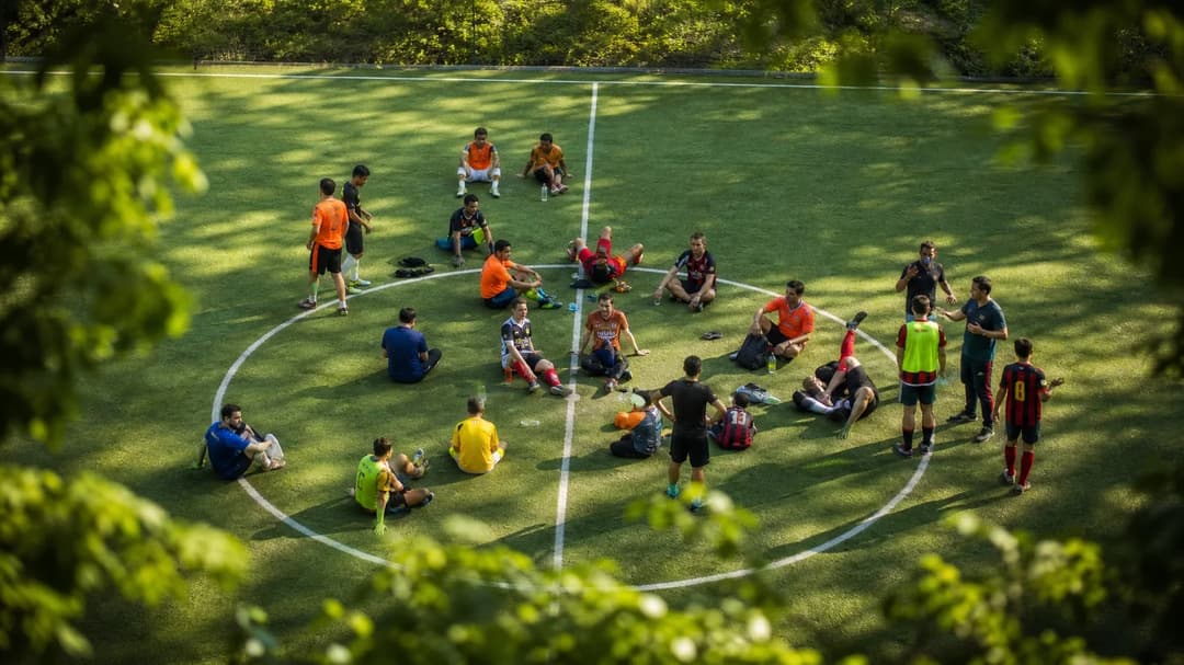 A bird's-eye view of a vibrant soccer field with players engaged in conversations post-match.
